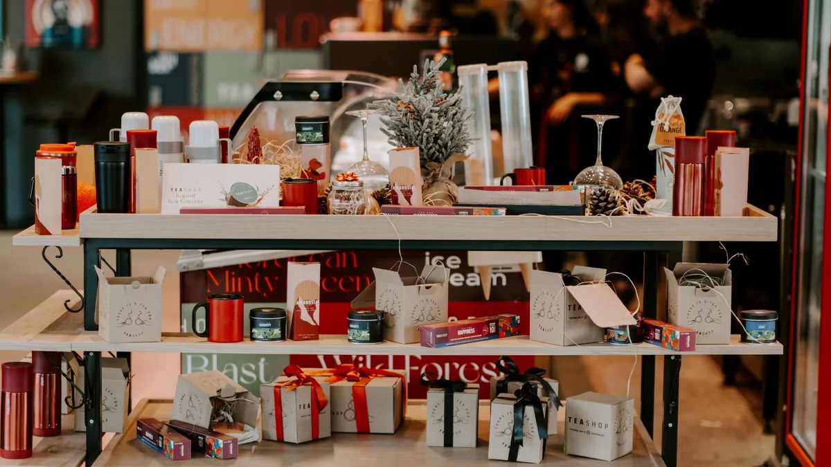 Christmas display of wrapped gifts, decorations and festive packaging on shelves