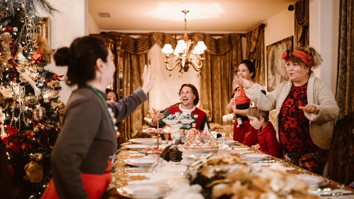 Family gathered around a festive Christmas dinner table