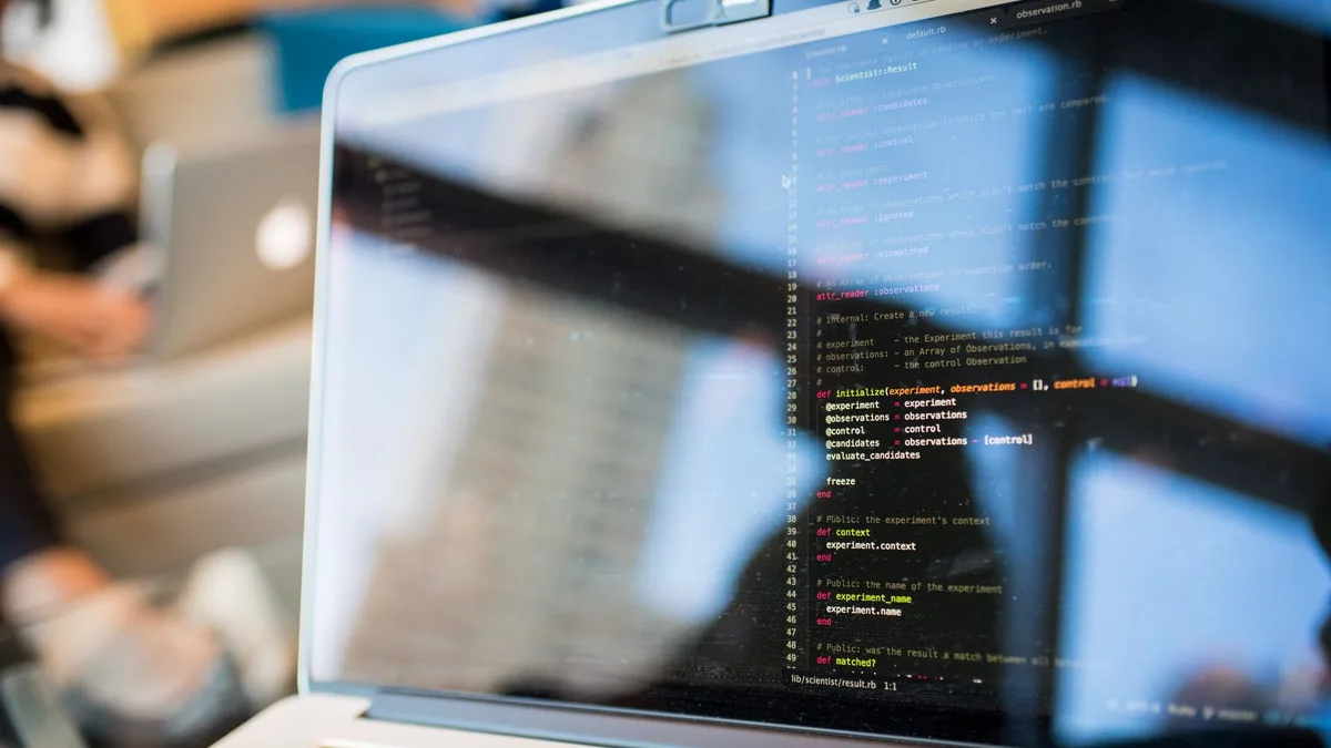Laptop screen showing lines of code